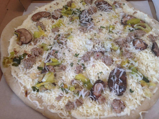 Feature Pizza- Fennel Sausage: Red or white sauce, spicy Italian fennel sausage, mushrooms, leeks, mozzarella, parmesan