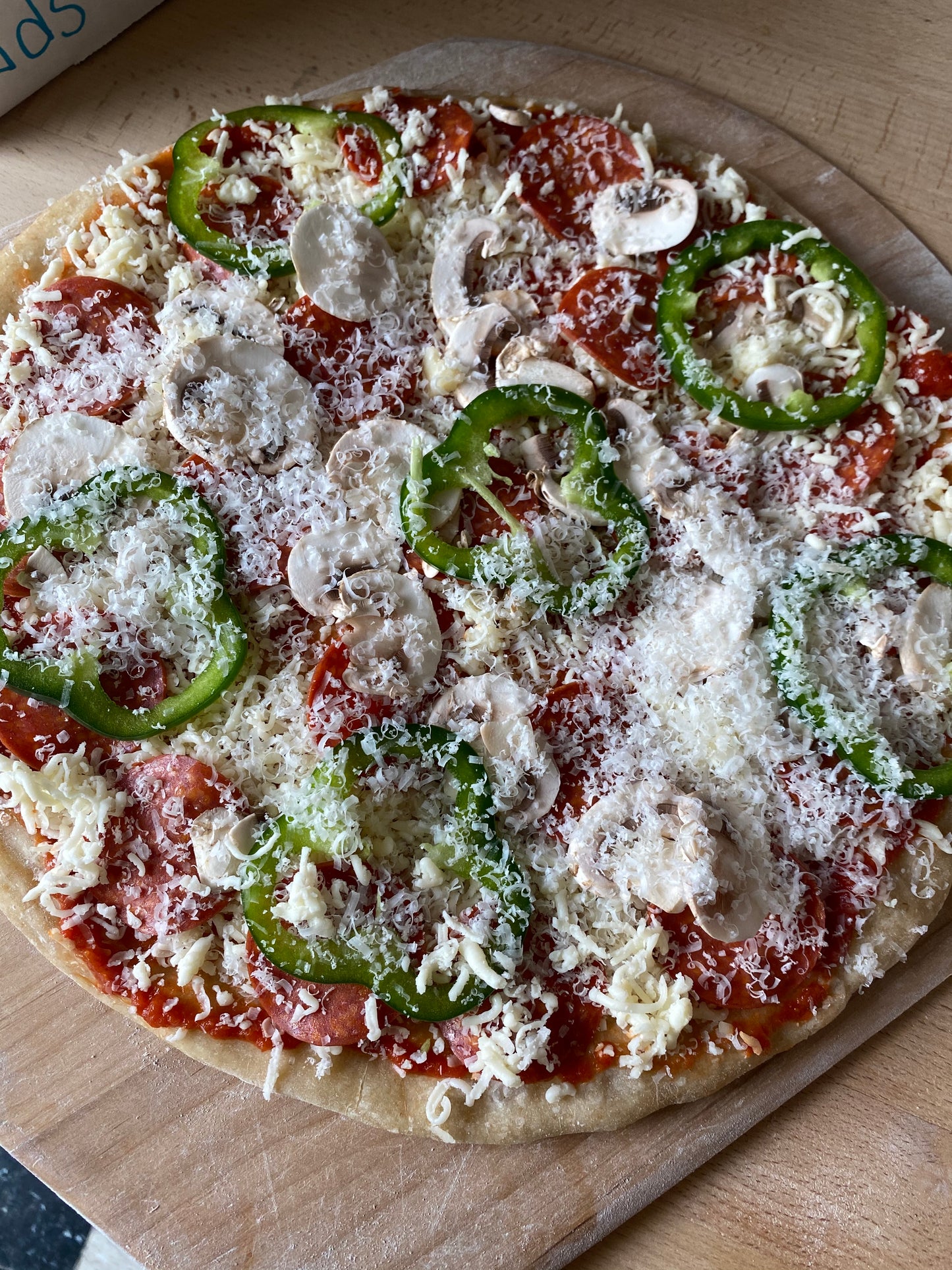 Feature Pizza- Pepperoni, mushrooms, green peppers, mozzarella, parmesan