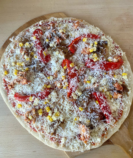 Feature Pizza- Tomato sauce, roasted chipotle chicken, corn, peppers, caramelized onions, mozzarella, parmesan