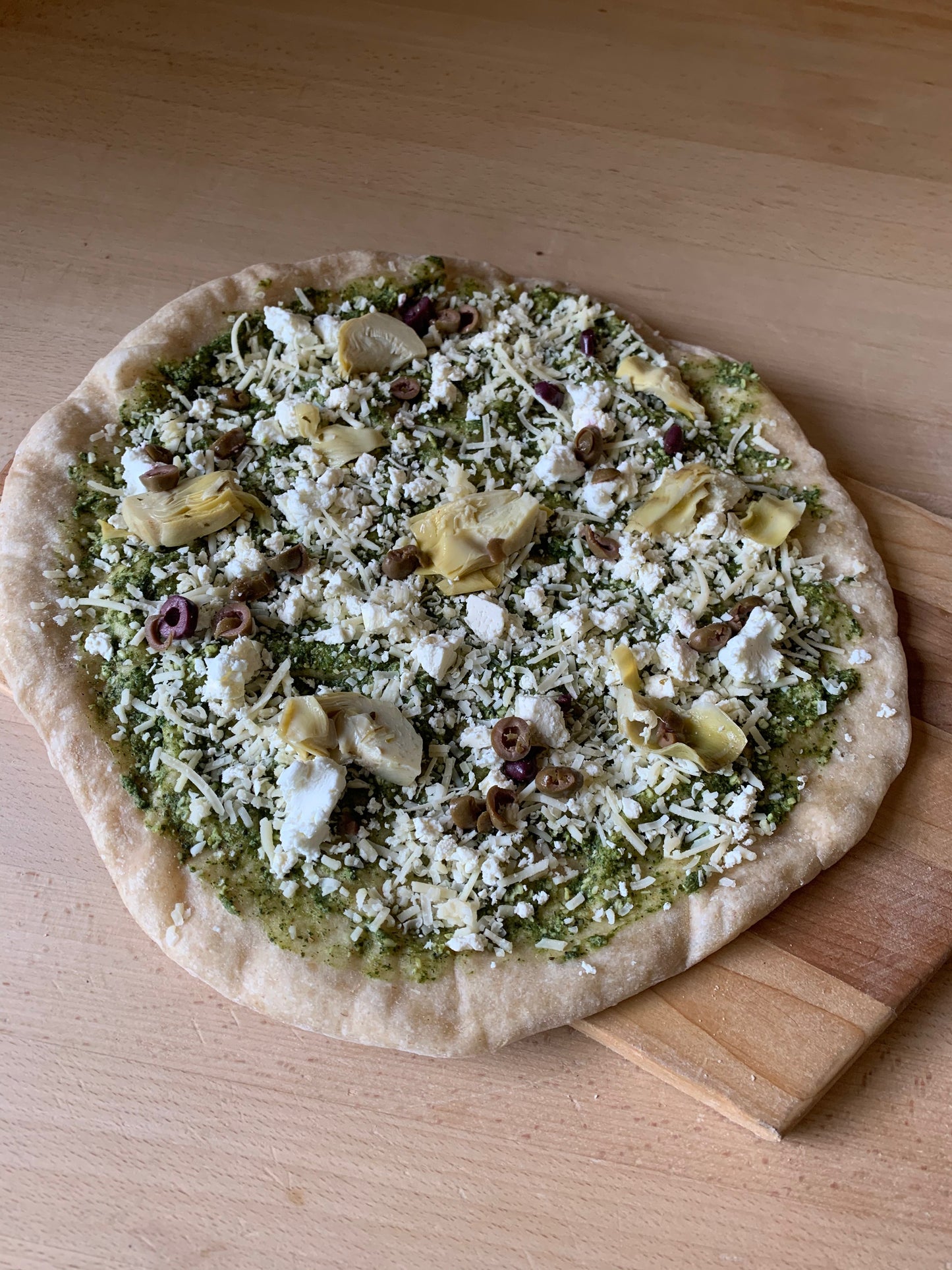 3 Cheese and Artichoke Pizza- Pesto, artichoke hearts, olives, asiago, feta, chevre